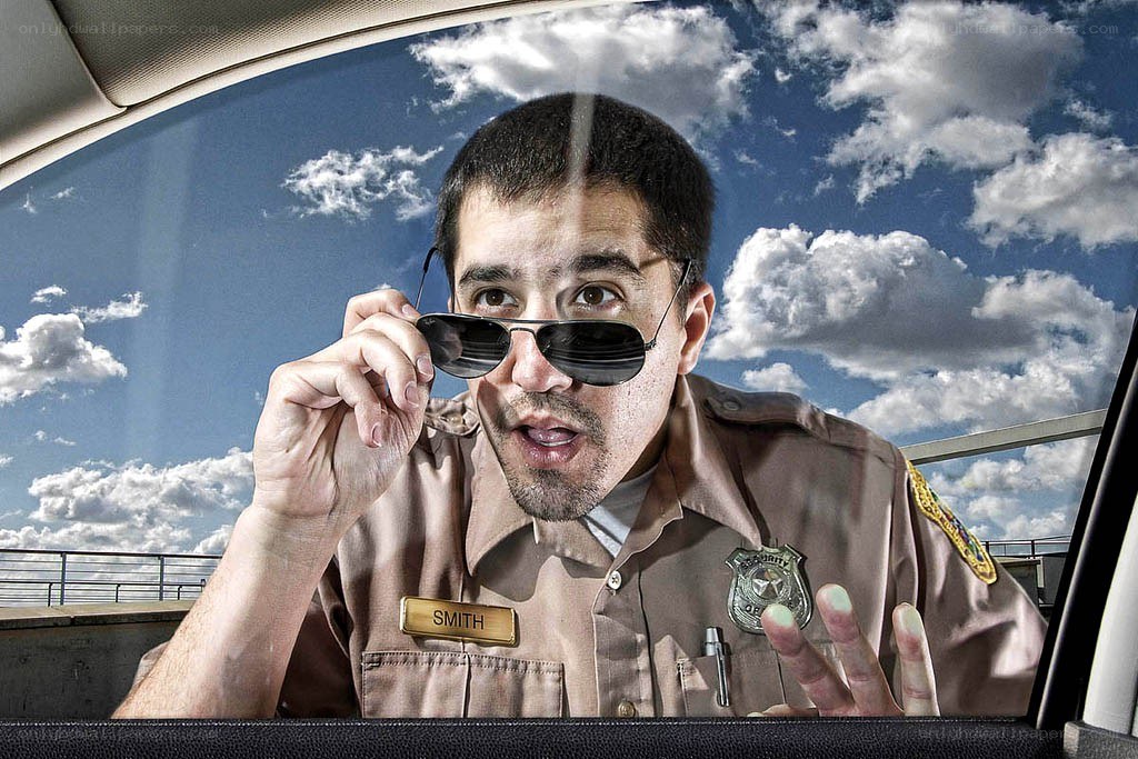 Police officer at car window