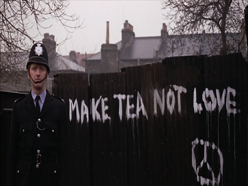 Police officer near graffiti