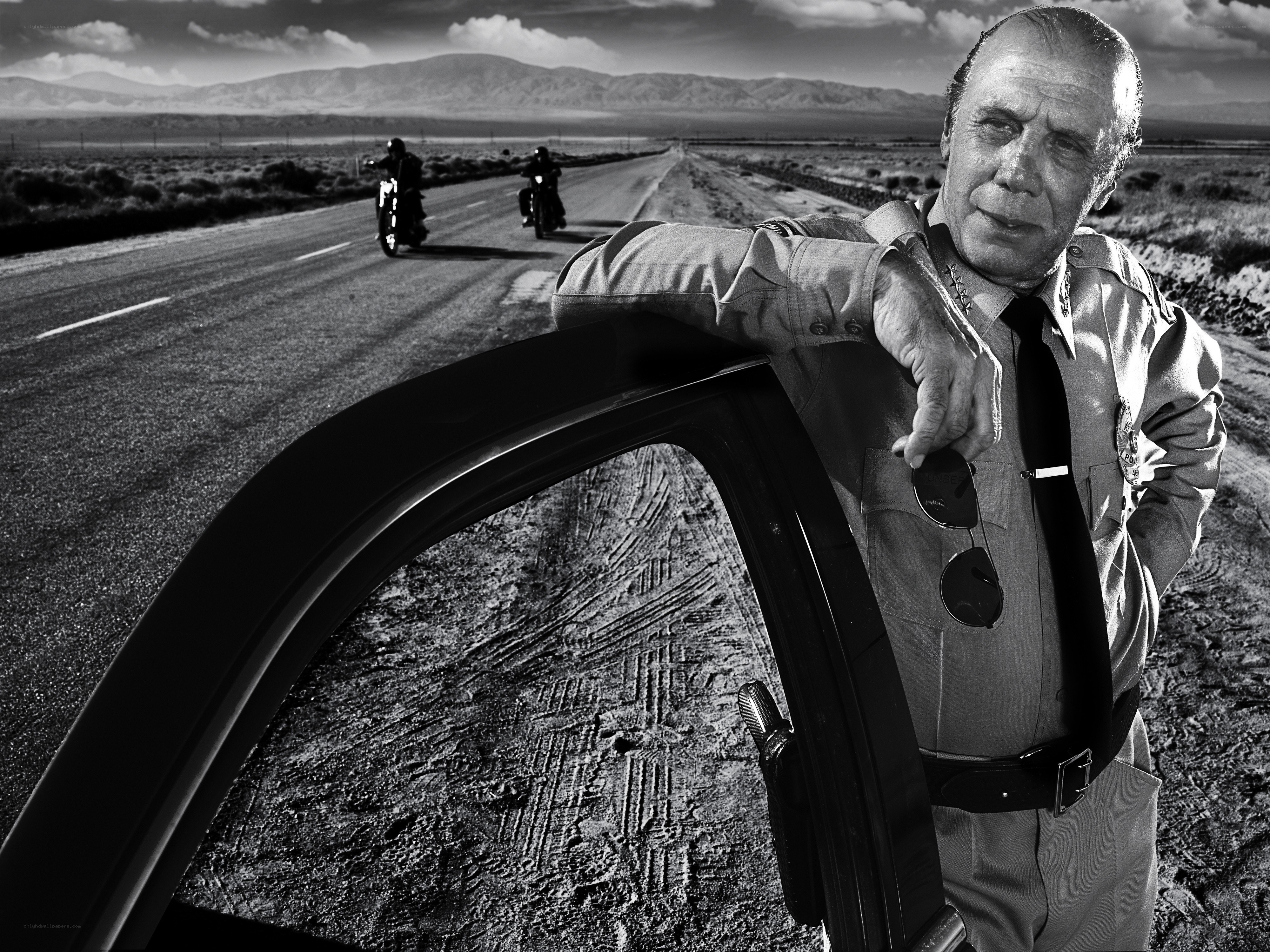 Police officer on desert road