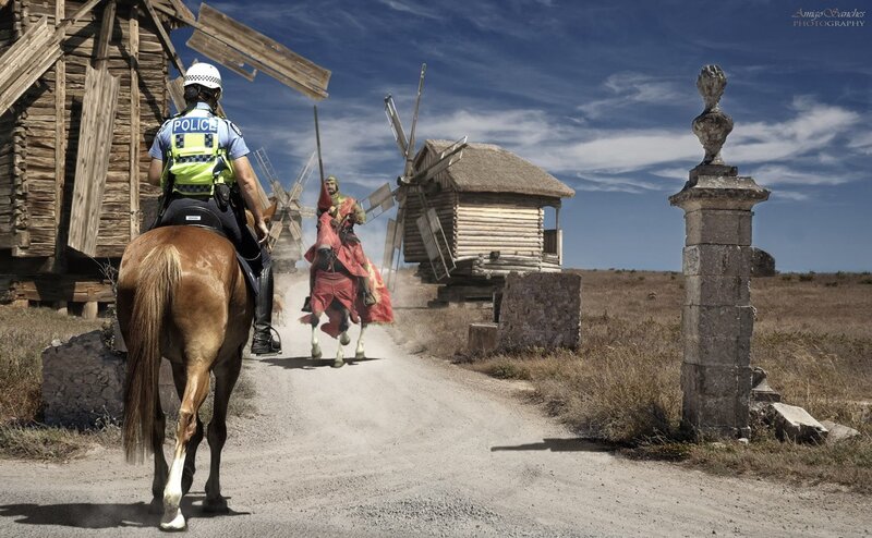 Police officer on horseback chasing Don Quixote