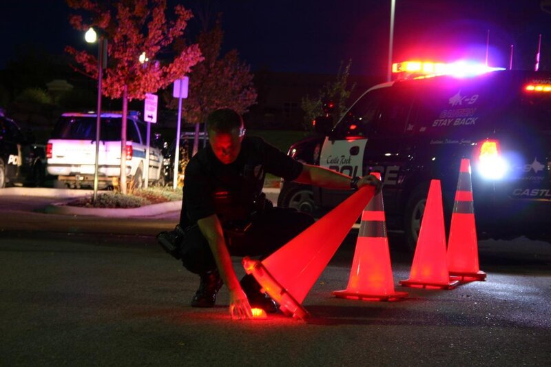 Police Officer Placing Cones
