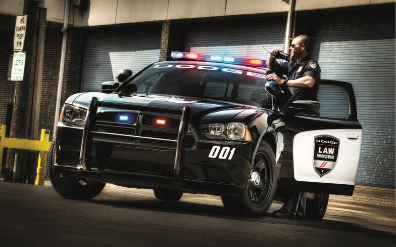 Police officer with Dodge car