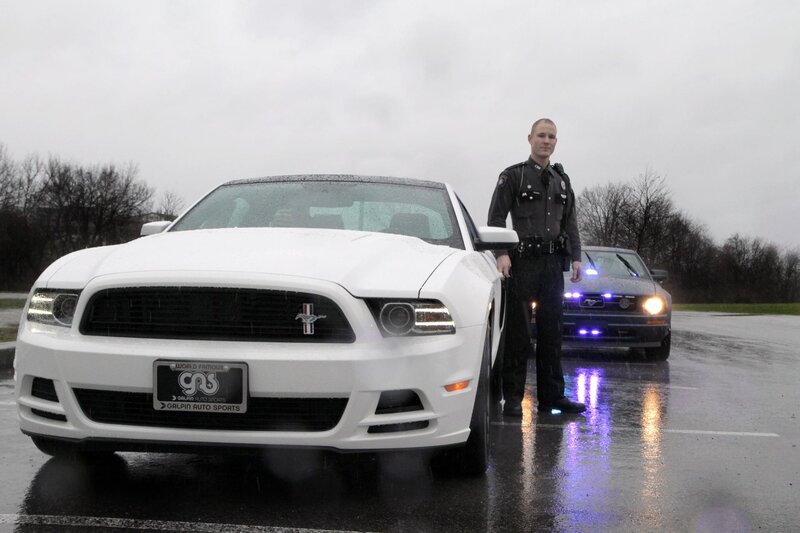 Police officer with white Mustang