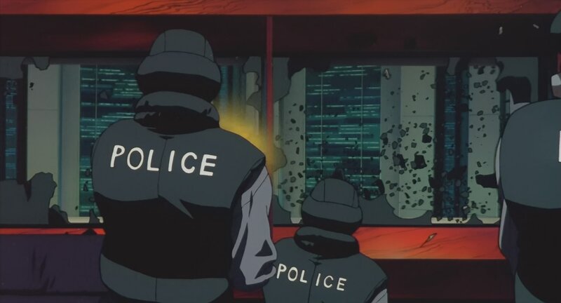 Police officers at a shattered window