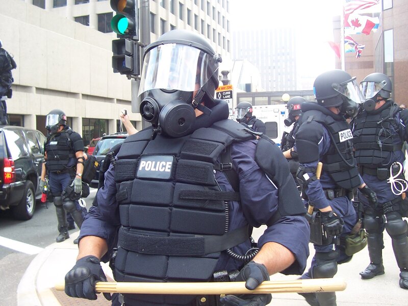 Police Officers in Riot Gear — Black, Tense, Afternoon