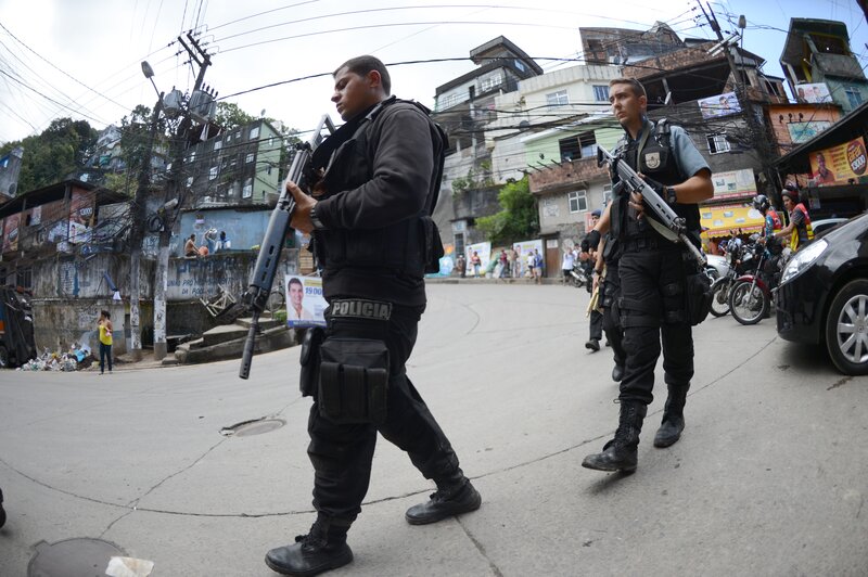 Police officers on patrol in a favela