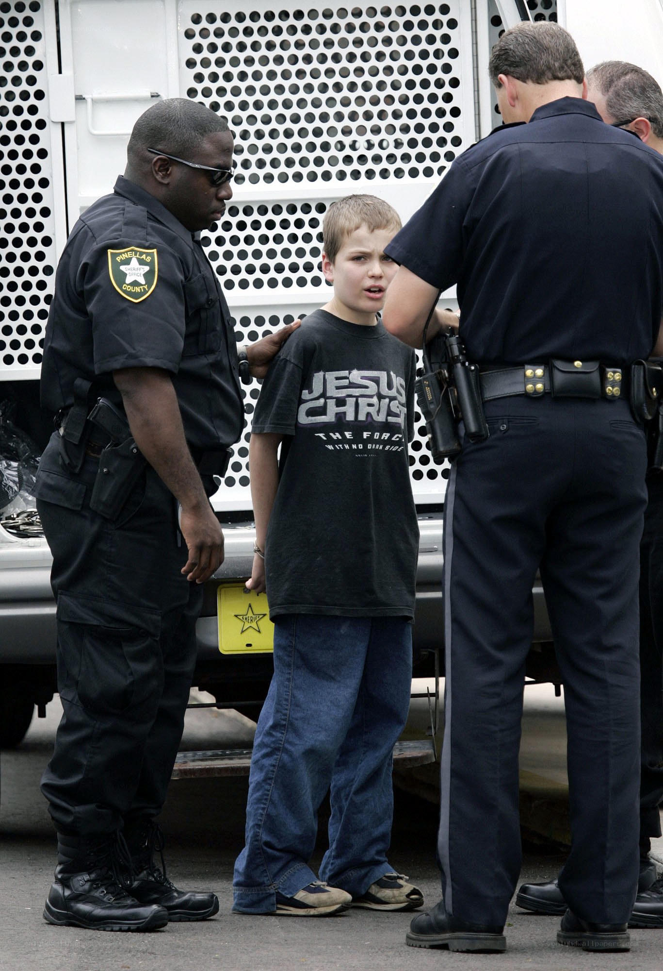 Police officers with a young boy