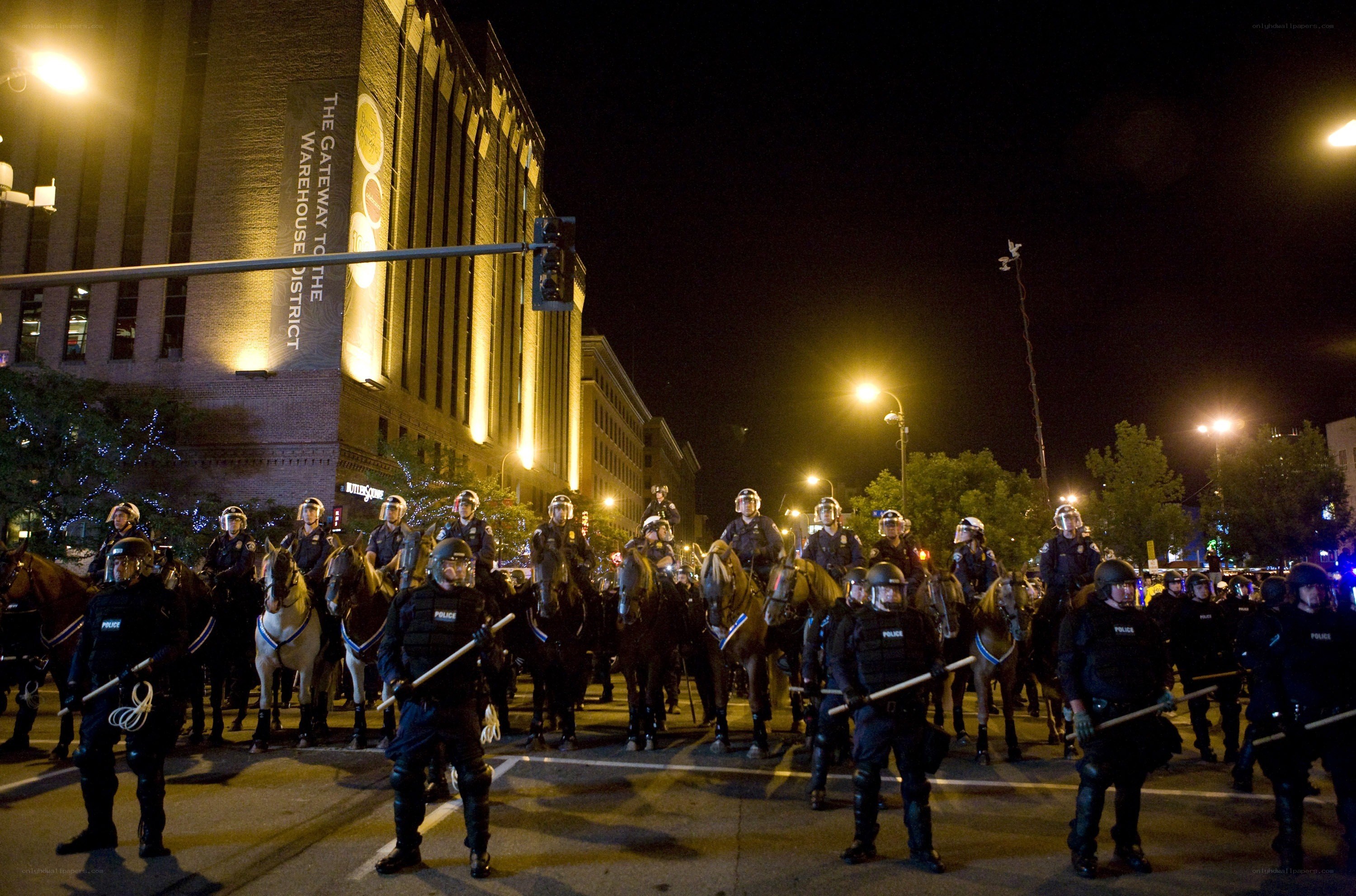 Police on horseback at night