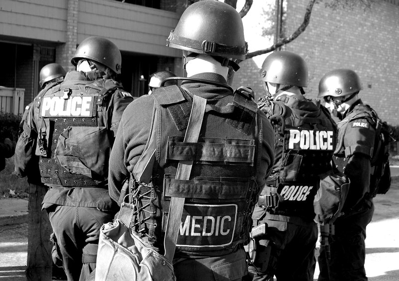 Police tactical team with medic