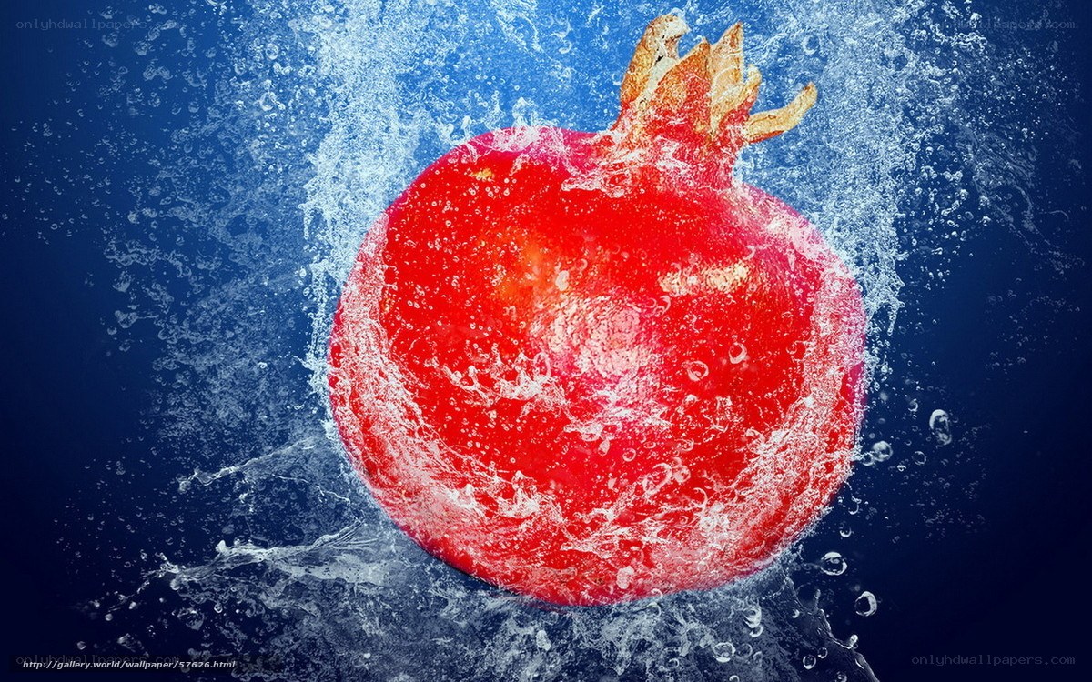 Pomegranate splashing in water