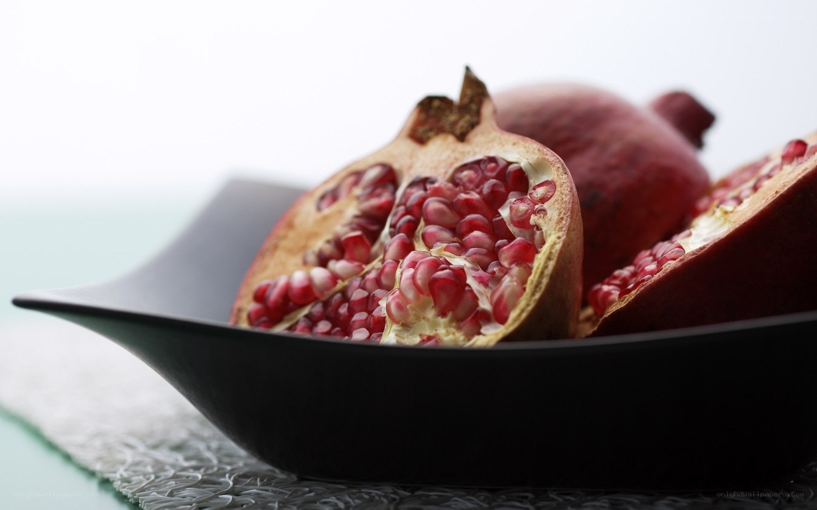 Pomegranates in a black bowl