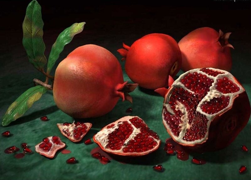 Pomegranates on green surface