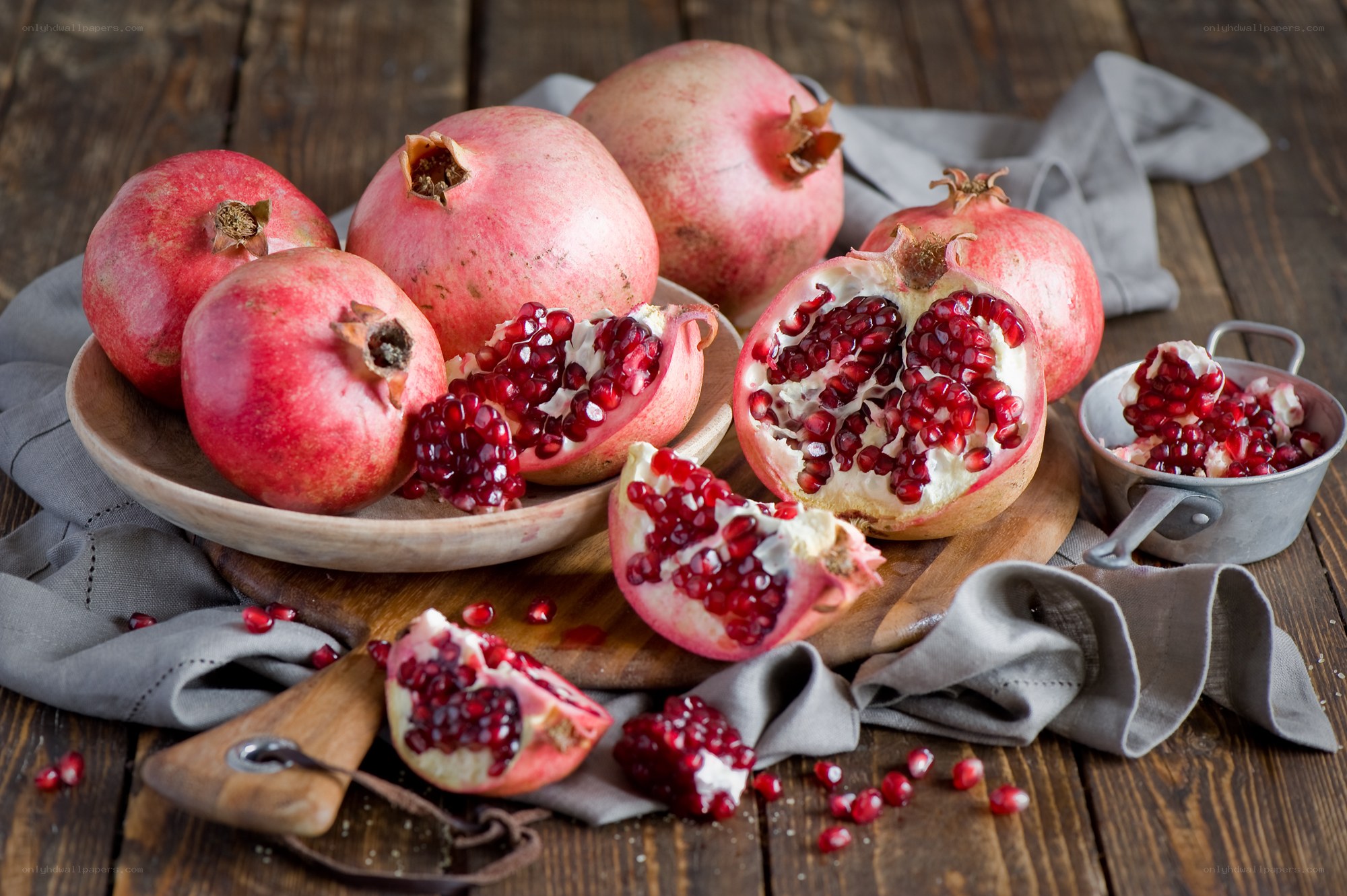 Pomegranates on wooden table
