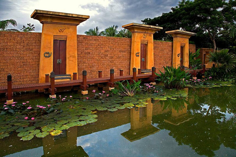 Pond with lotus flowers and temple doors