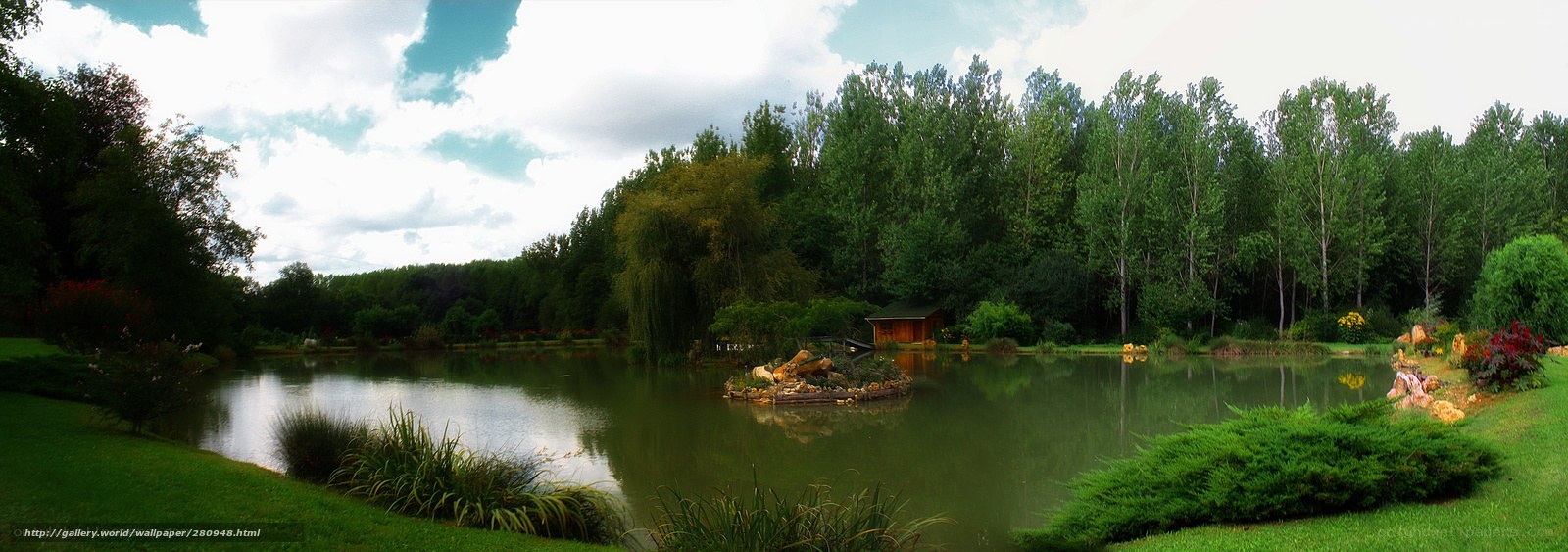 Pond with wooden hut and trees