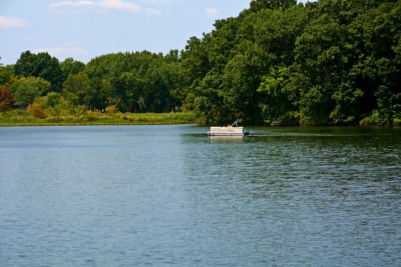 Pontoon Boat on Lake — Blue