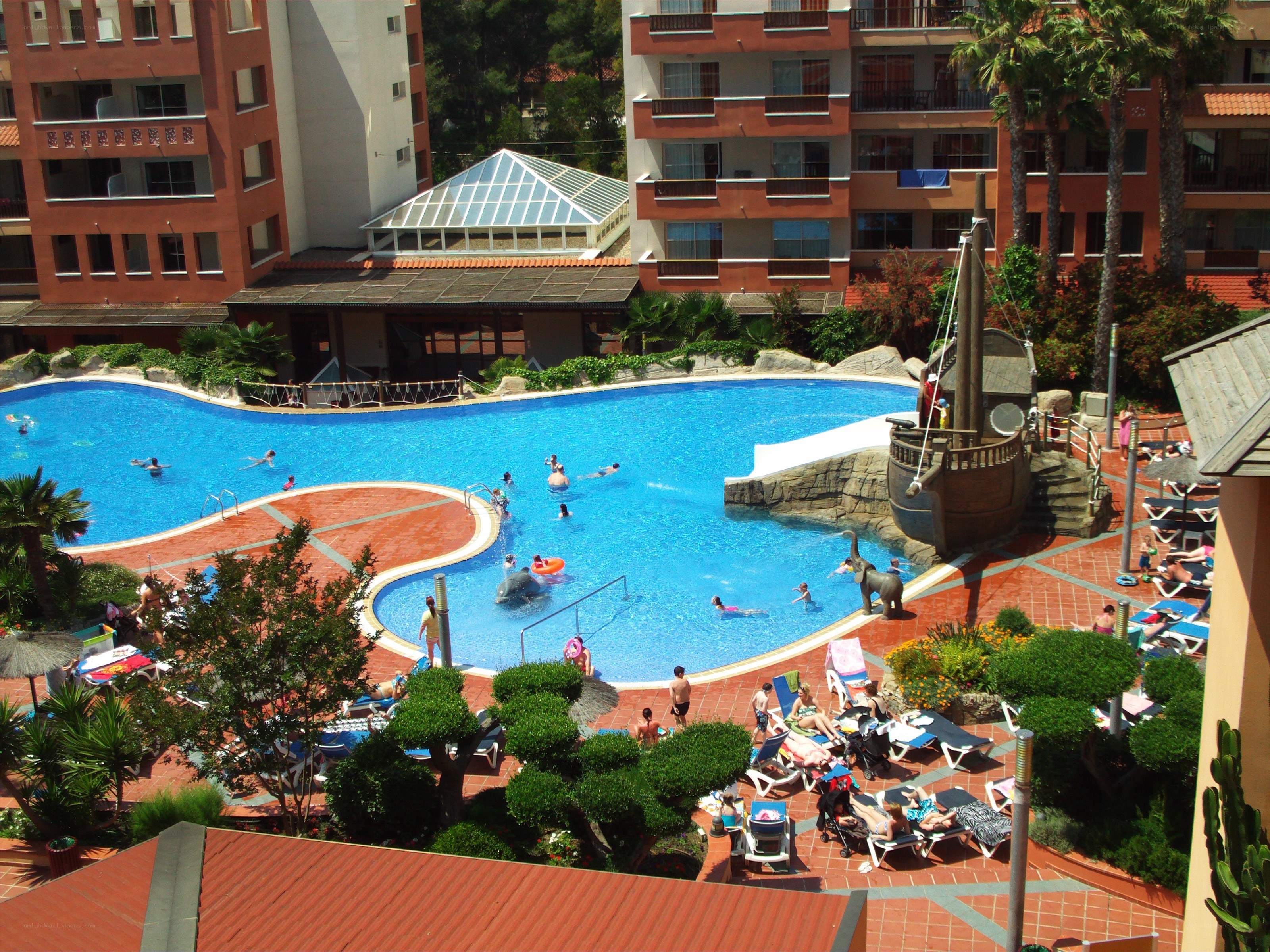 Pool area at resort with pirate ship