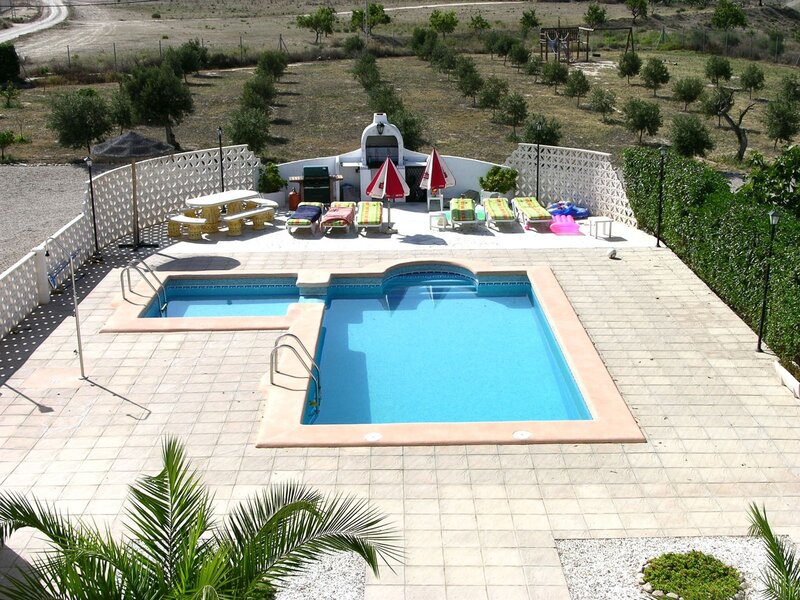 Pool area with lounge chairs