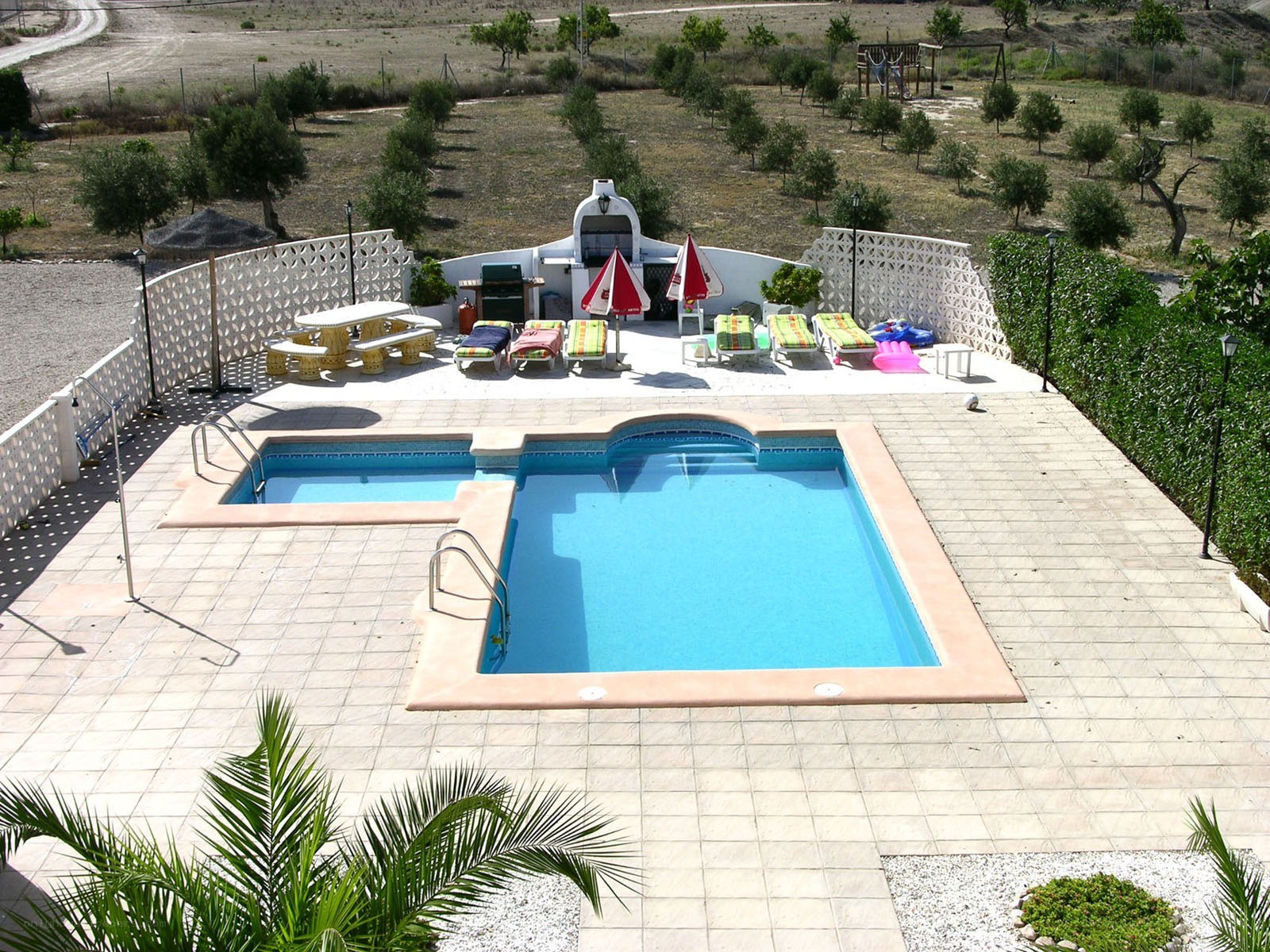 Pool area with lounge chairs