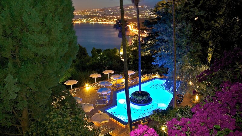 Pool at Night with City View