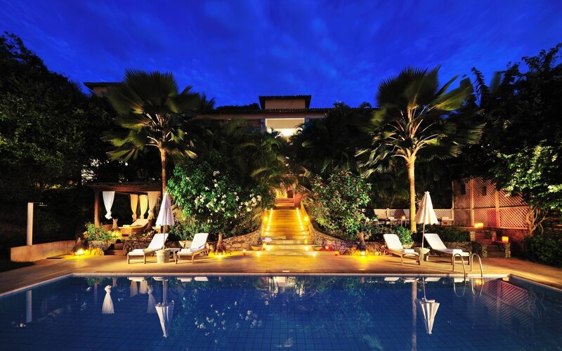 Pool at Night with Lounge Chairs