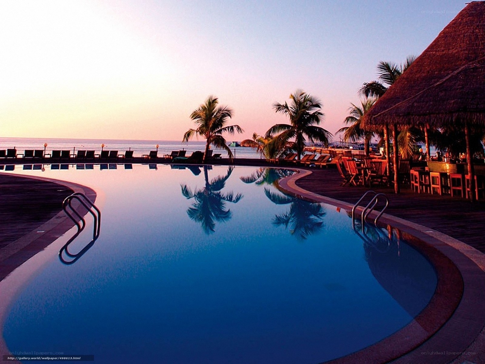 pool at sunset by the ocean