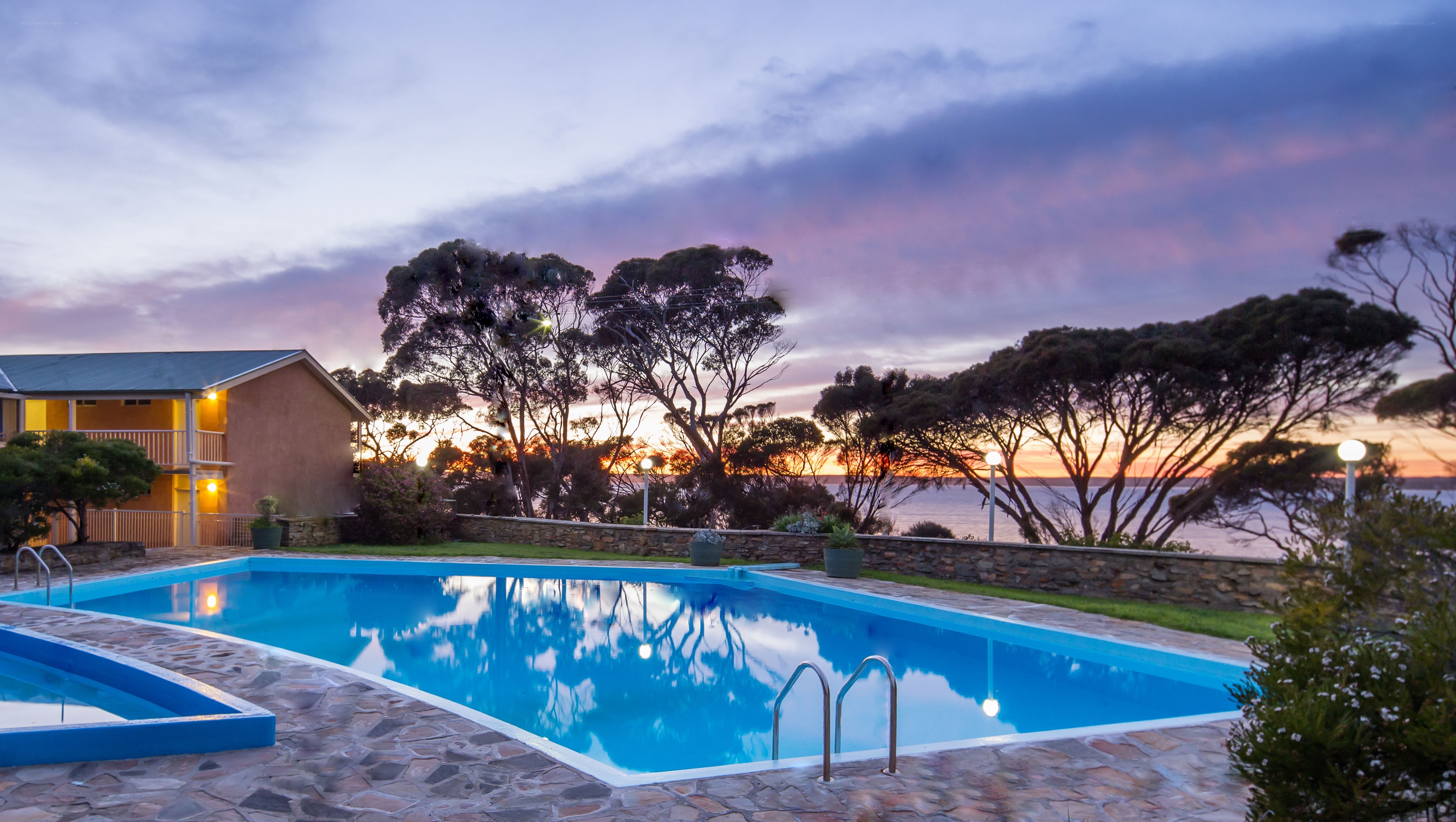 Pool at sunset by the sea
