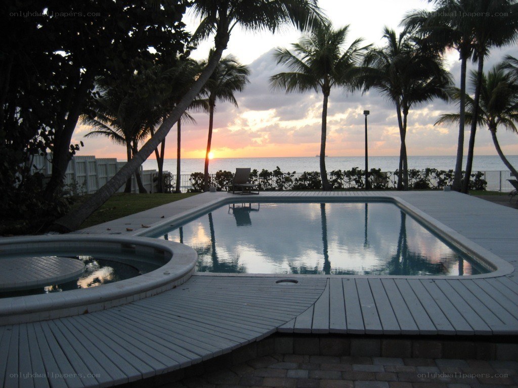 pool at sunset with ocean view