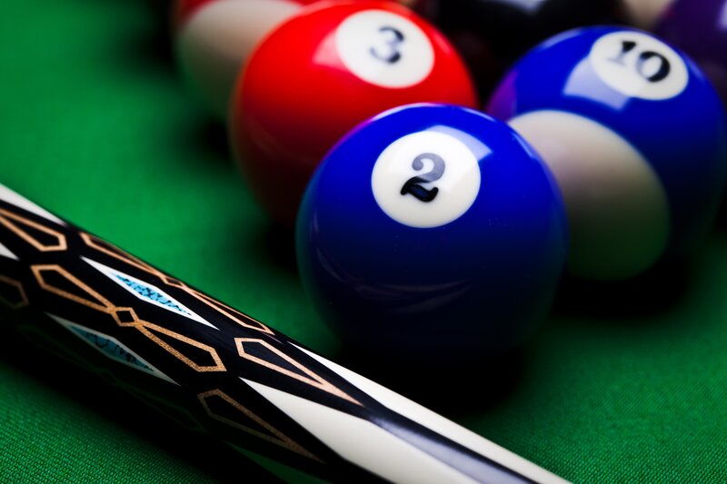 Pool Balls and Cue Stick — Green, Focused