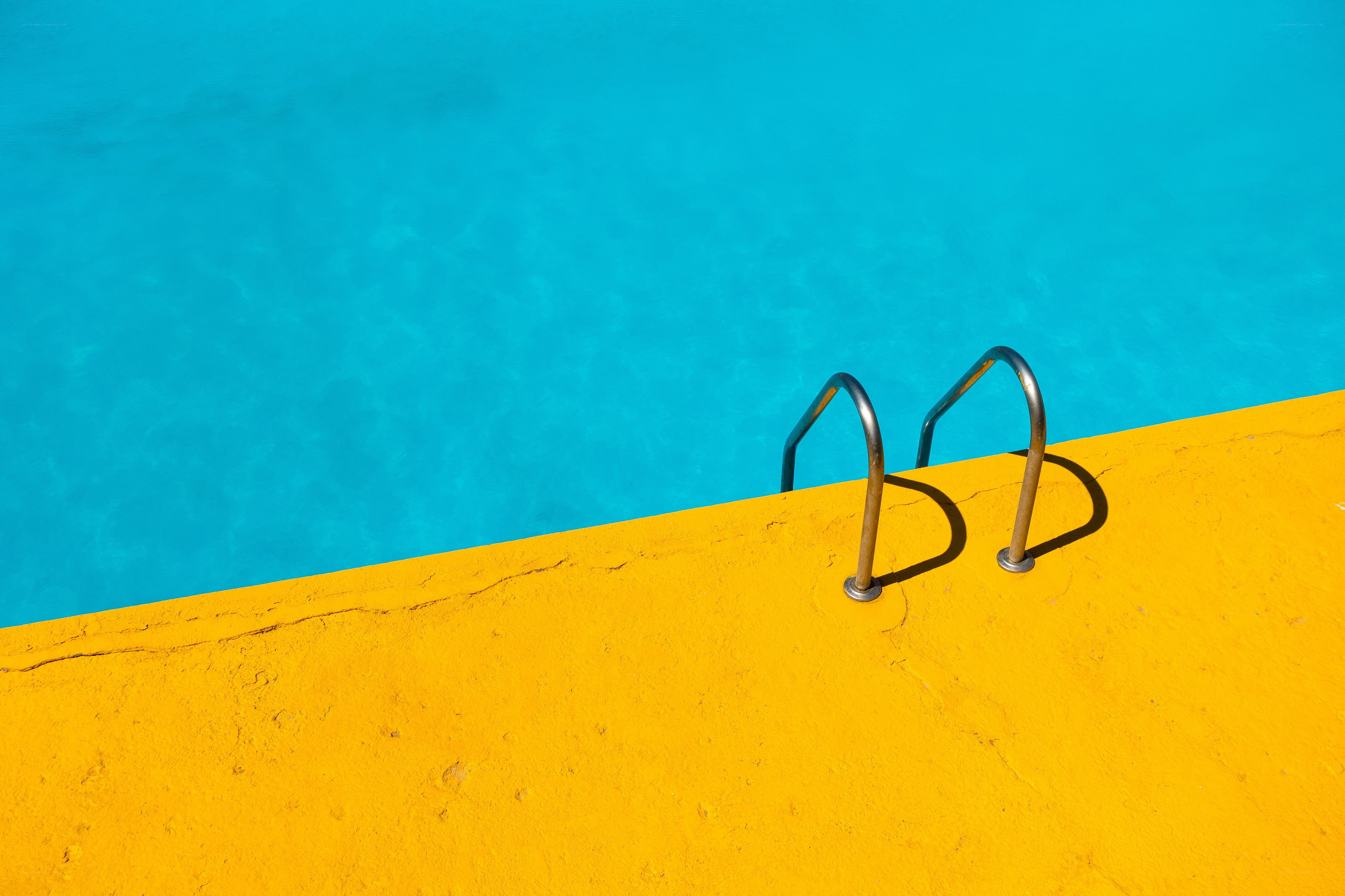 pool ladder on yellow edge