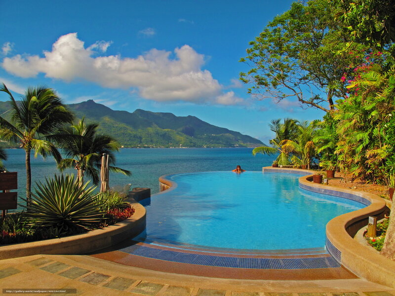 Pool overlooking ocean and mountains