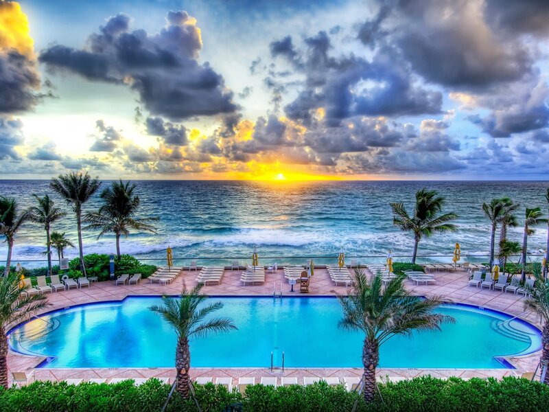 Pool Overlooking Ocean — Blue, Dramatic, Sunrise, Photograph, Palm Trees, Lounge Chairs