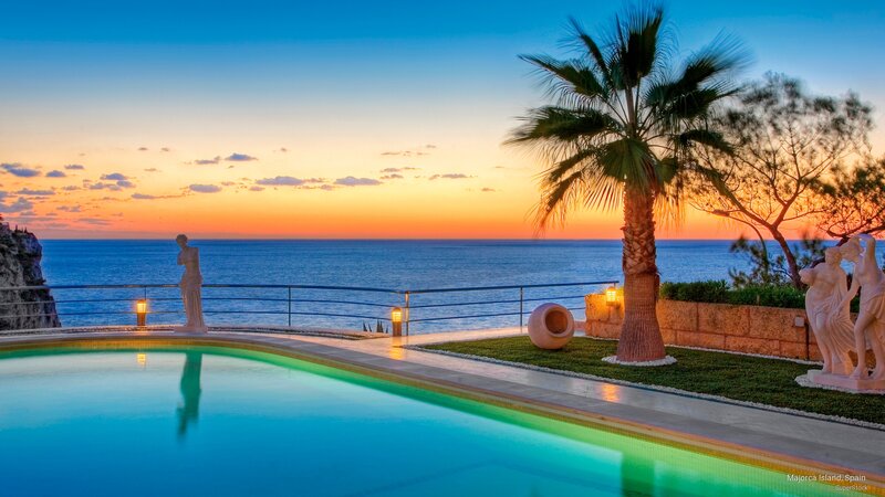 Pool Overlooking Ocean — Blue, Serene, Sunset, Photograph, Statues