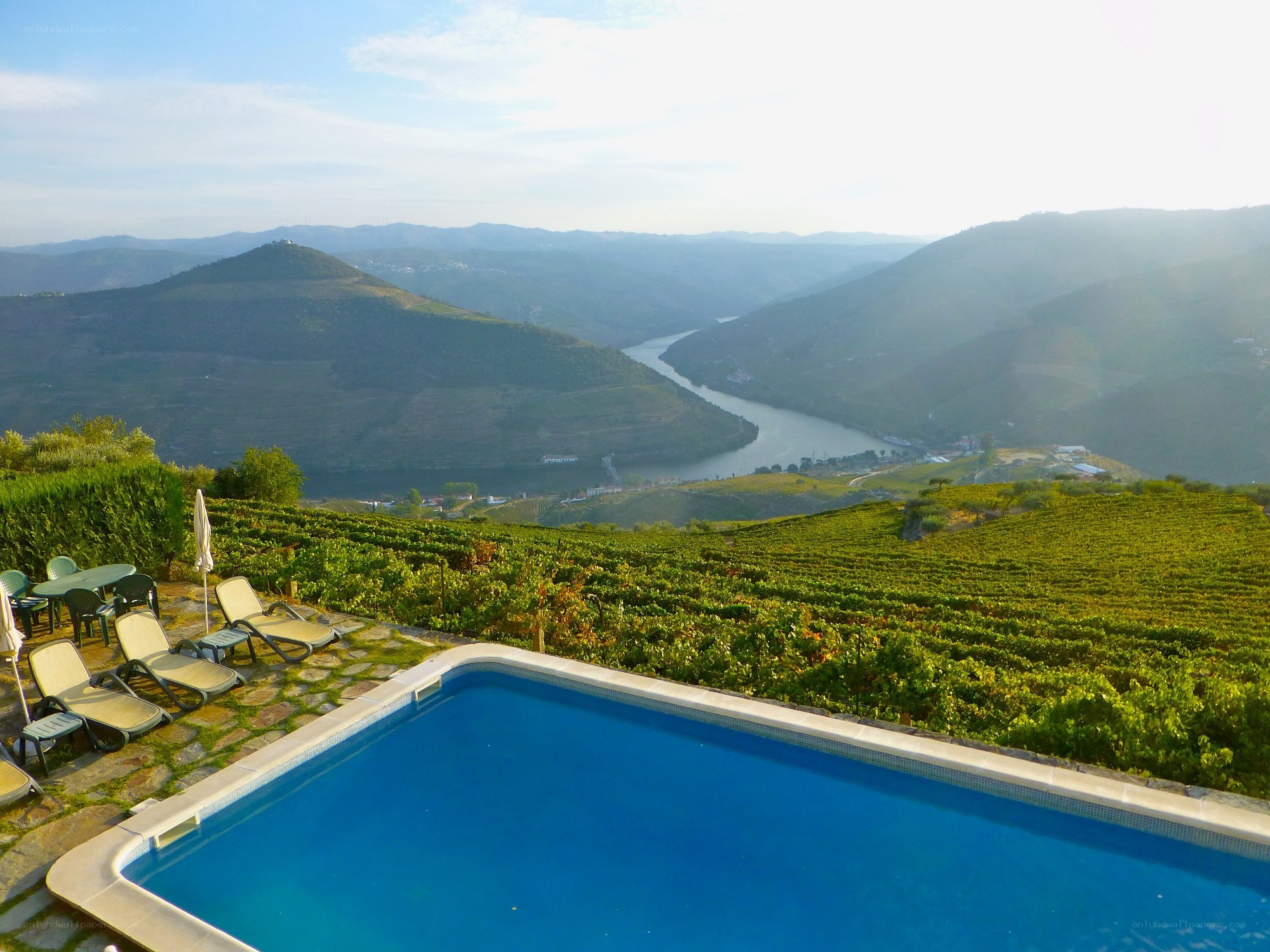 Pool overlooking vineyards and river