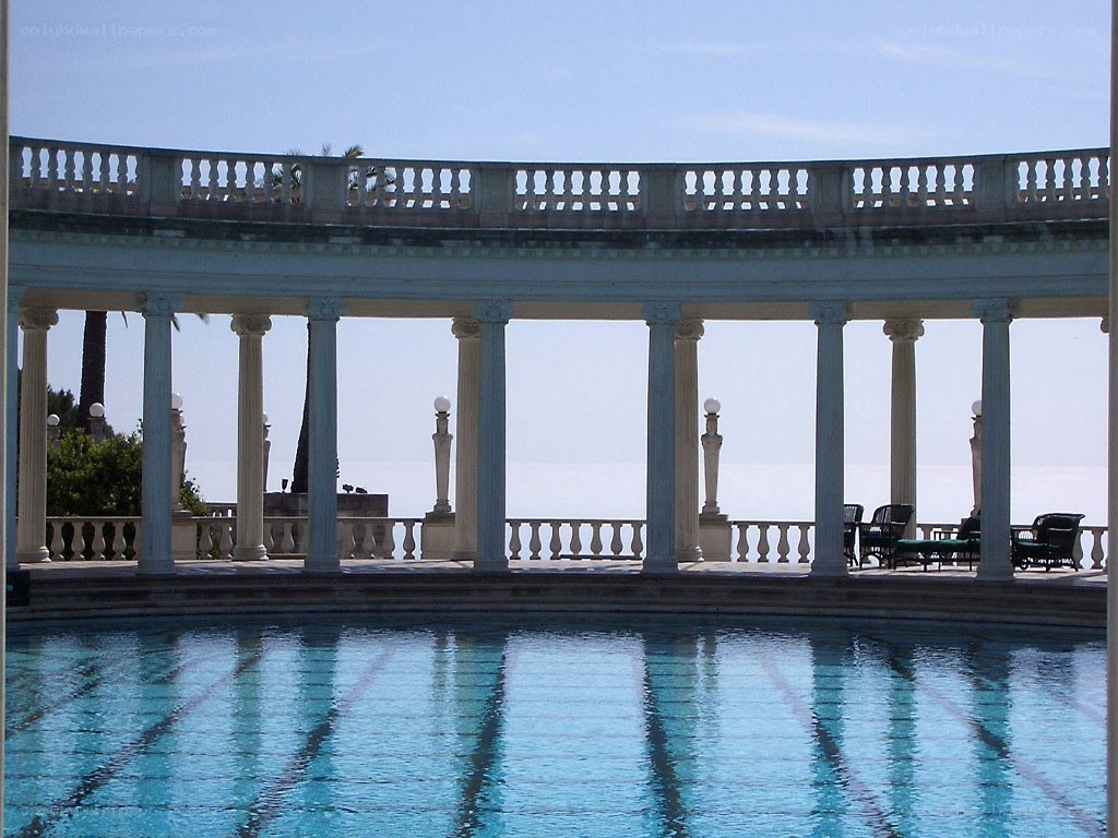 Pool with colonnade and sea view