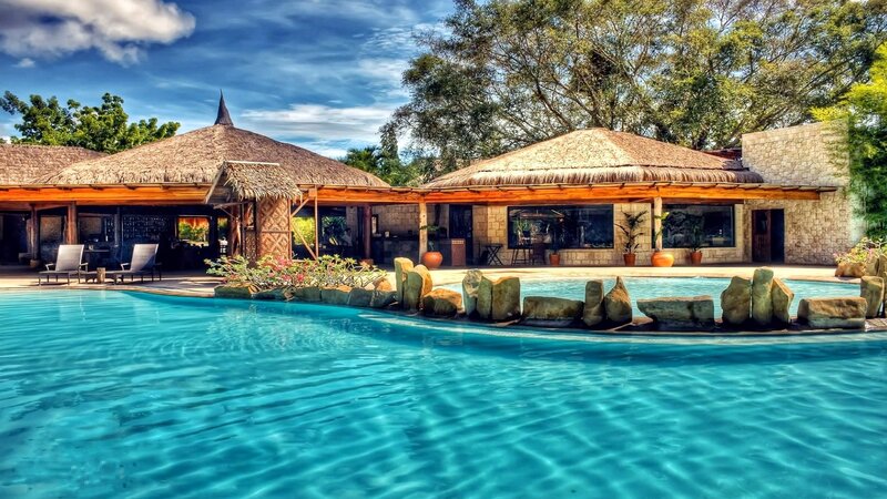 Pool with Thatched-roof Buildings