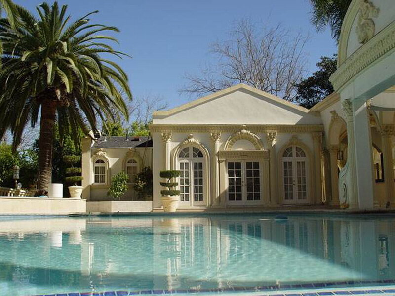 Poolside Building with Palm Tree