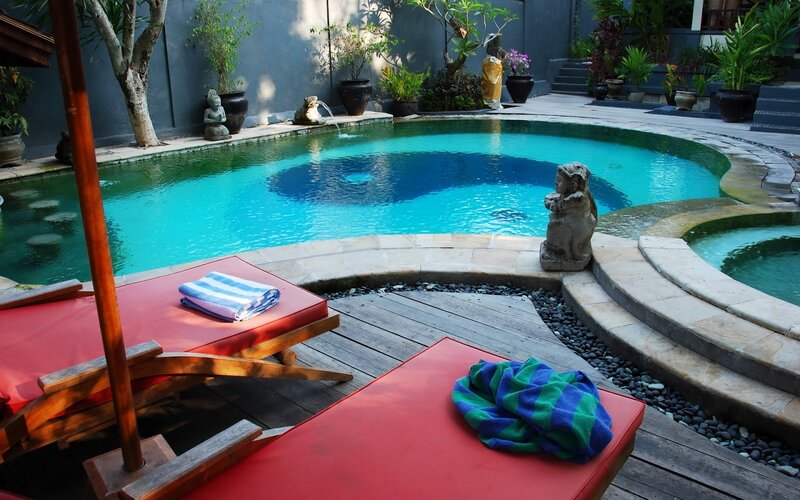 Poolside Lounge Area — Blue, Serene, Afternoon, Photograph, Lounge Chairs, Statues