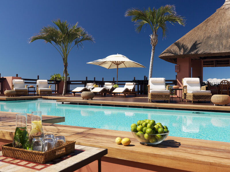 Poolside Lounge Area — Blue, Serene, Afternoon, Photograph, Palm Trees, Umbrella