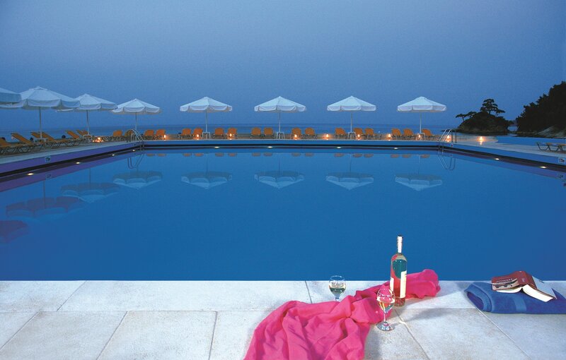 Poolside Lounge Area — Blue, Serene, Night, Photograph