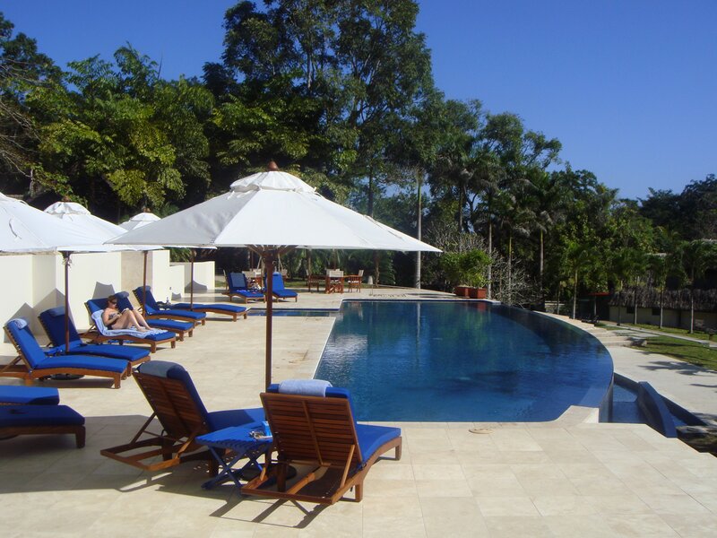 Poolside lounge area with umbrellas