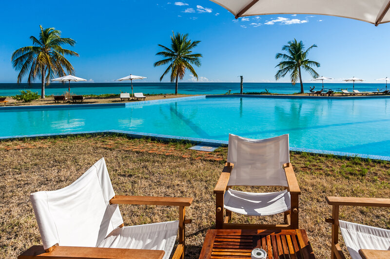 Poolside Lounge Chairs — Blue, Serene, Afternoon, Photograph, Palm Trees, Ocean