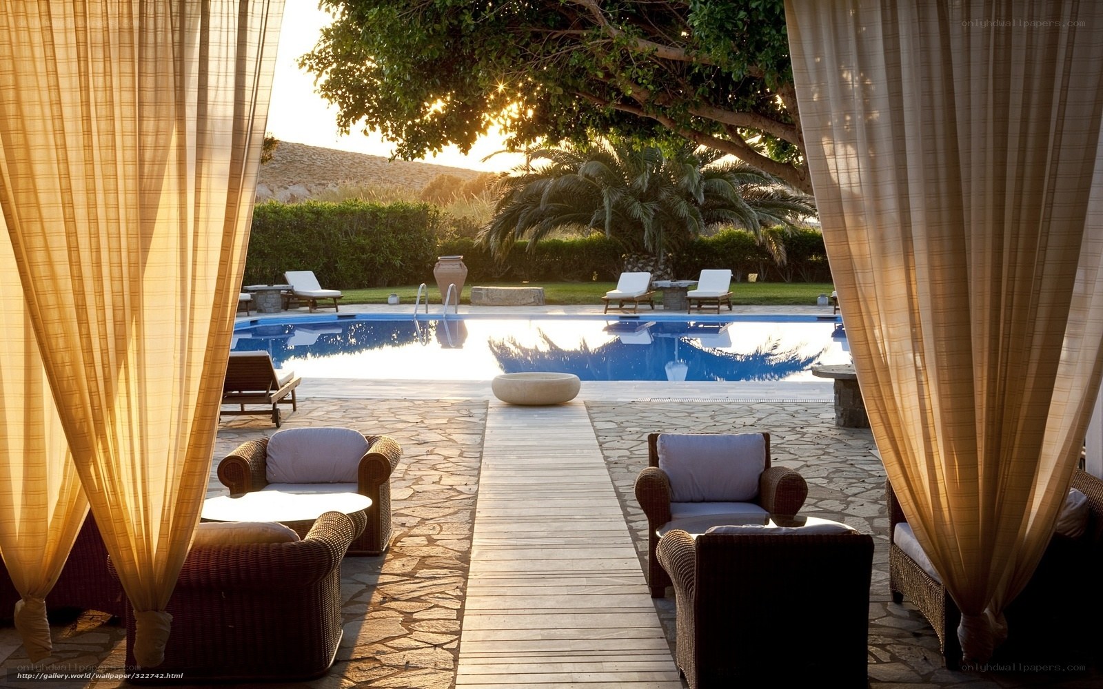 Poolside relaxation at sunset