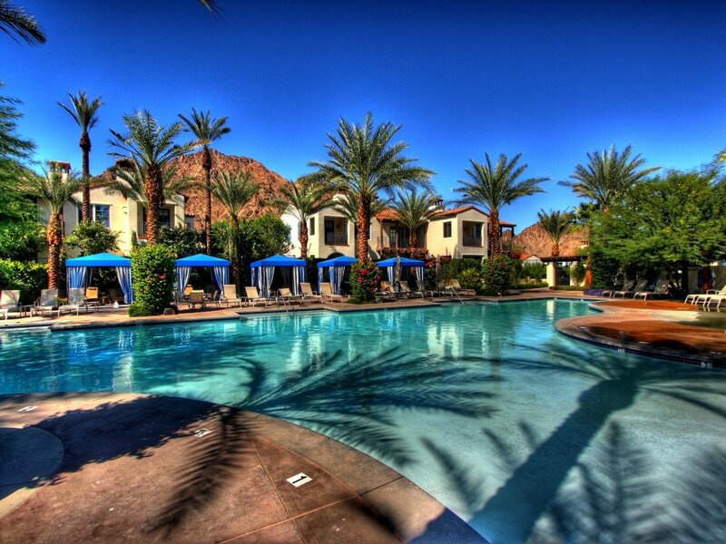 Poolside Resort Area — Blue, Serene, Afternoon, Photograph, Palm Trees, Buildings