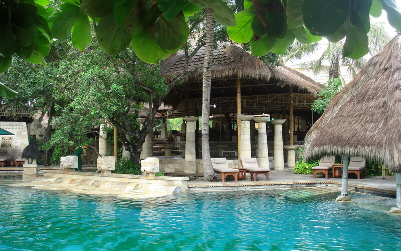 Poolside Resort Area — Blue, Serene, Afternoon, Photograph, Thatched Roof