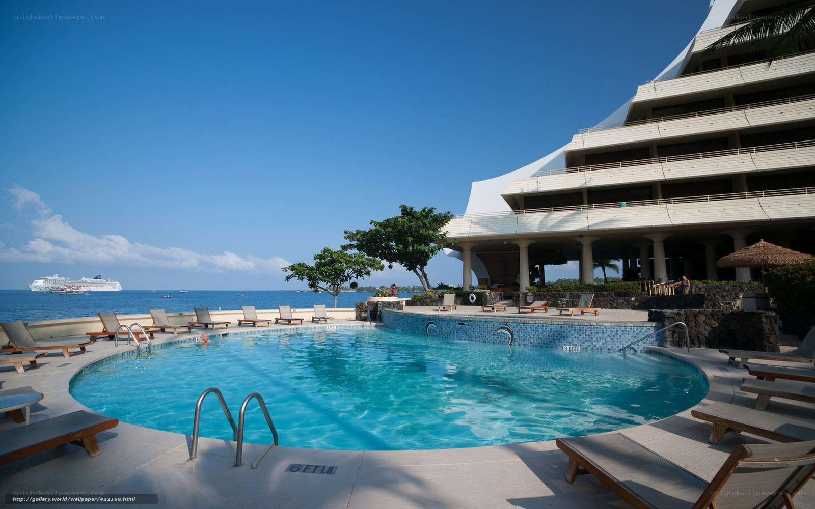Poolside resort with cruise ship view