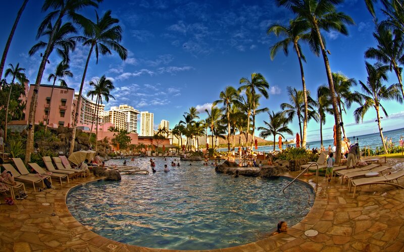 Poolside resort with palm trees