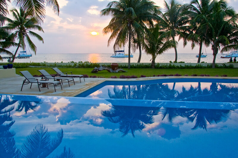 Poolside sunset with palm trees