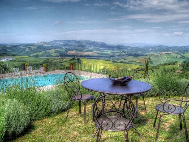 Poolside table with Tuscan view
