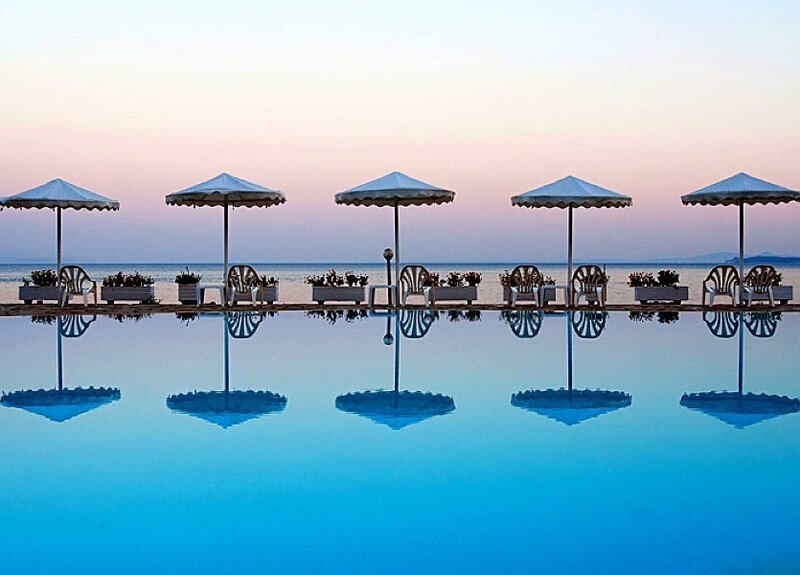 Poolside umbrellas at dusk